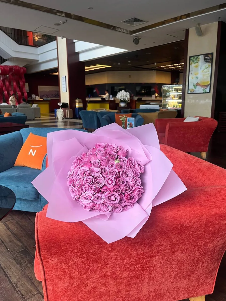 51 violet roses in white wrap delivery Nha Trang 1